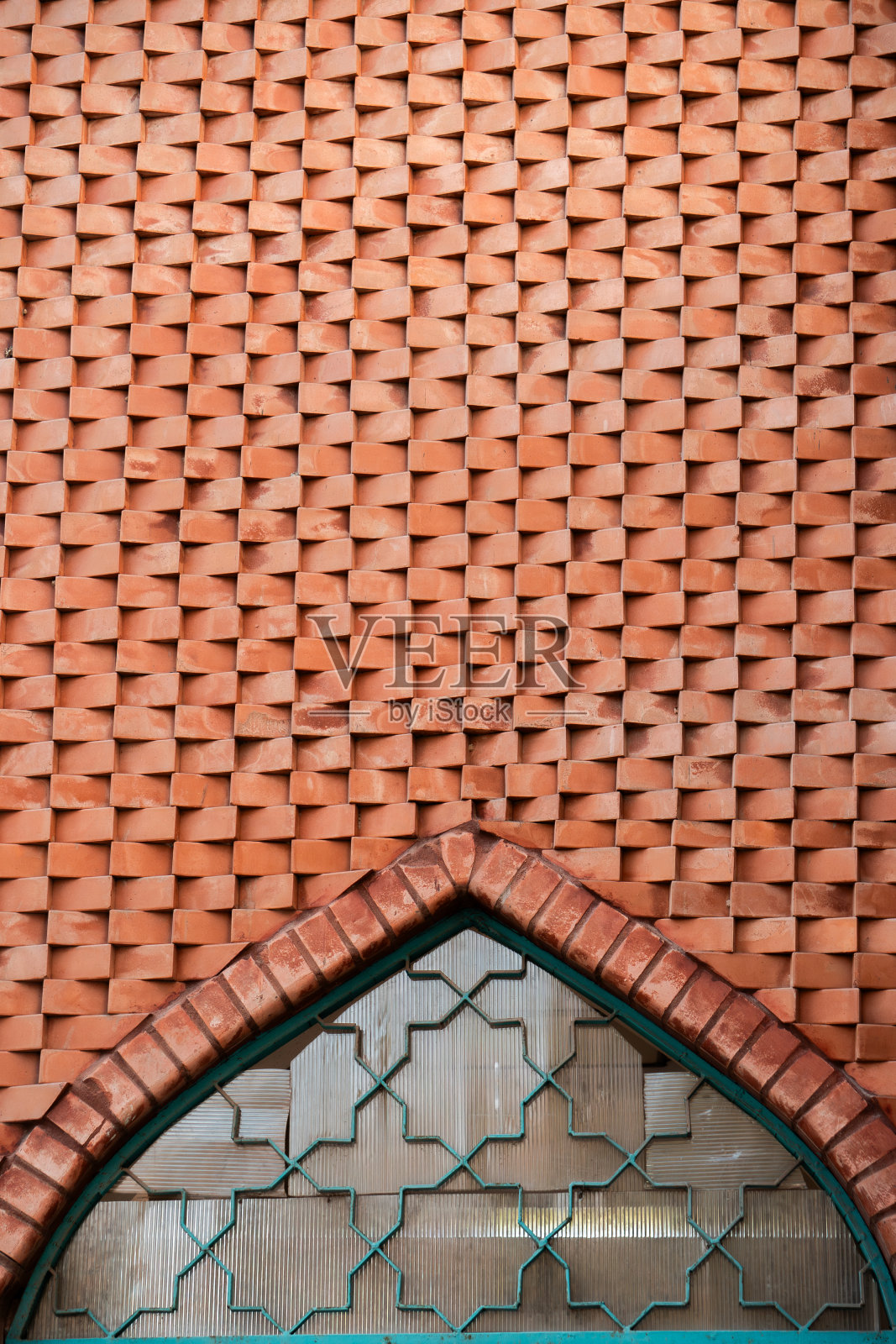 伊朗清真寺的棕色石墙和窗户照片摄影图片