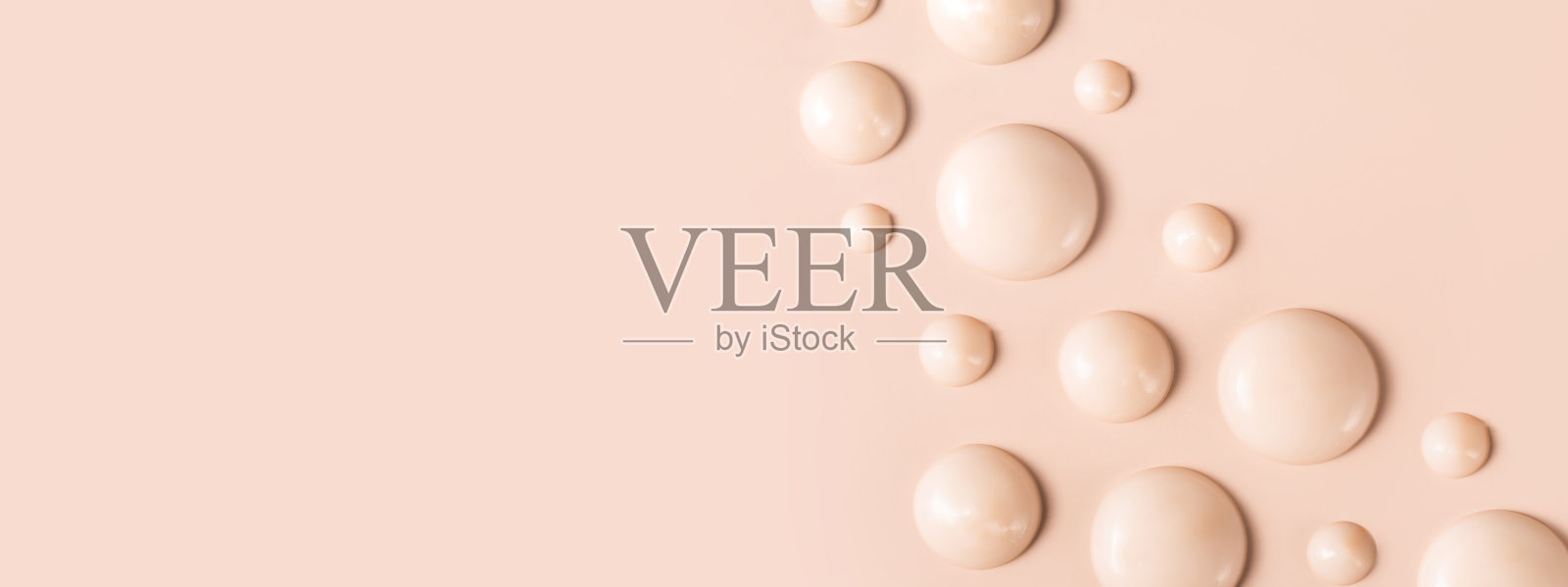 化妆品涂抹在米色背景上的奶油纹理滴照片摄影图片