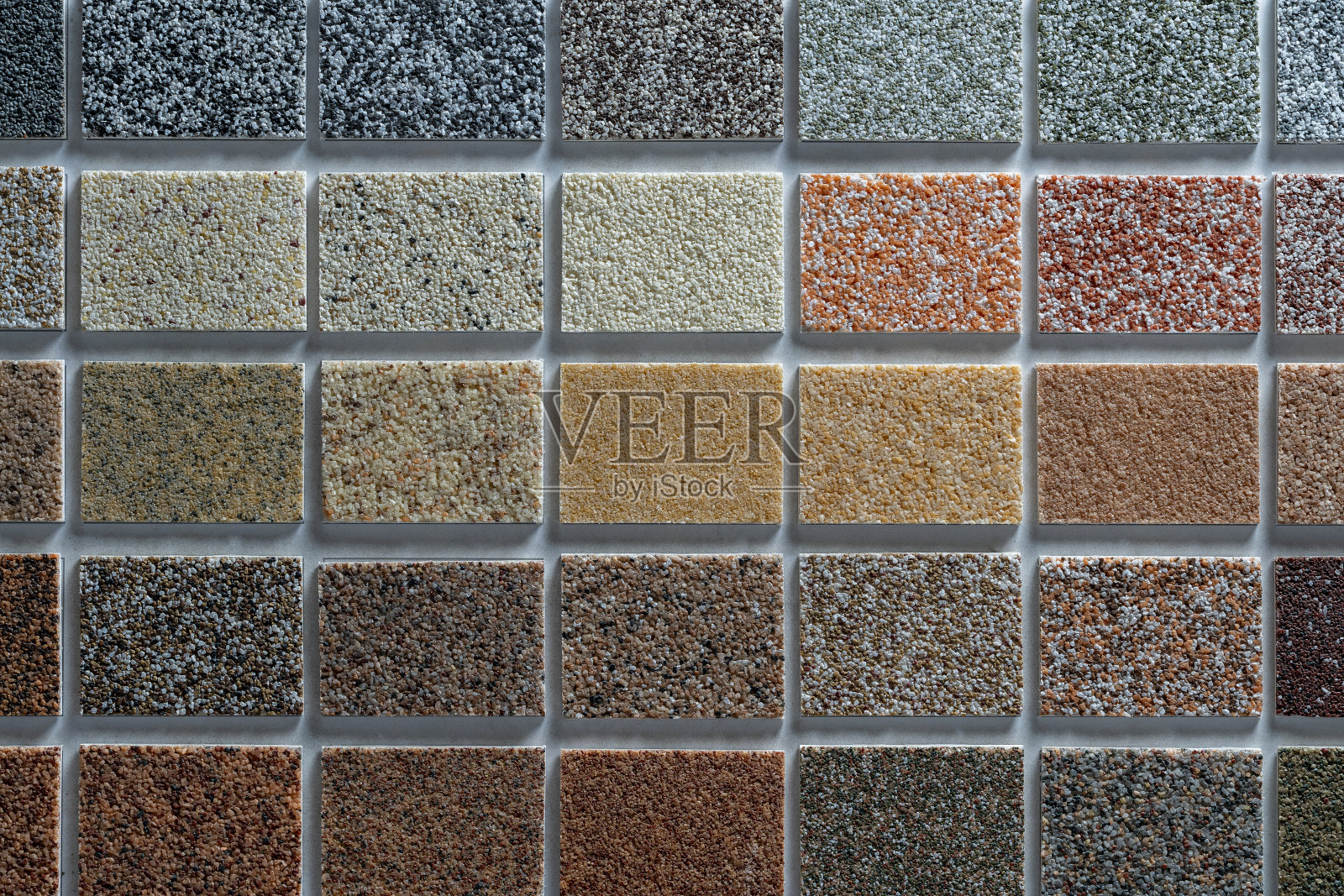 用于建筑立面和内部装饰的多色石膏样品，调色板。建筑材料在背景、特写、俯视图上的呈现照片摄影图片