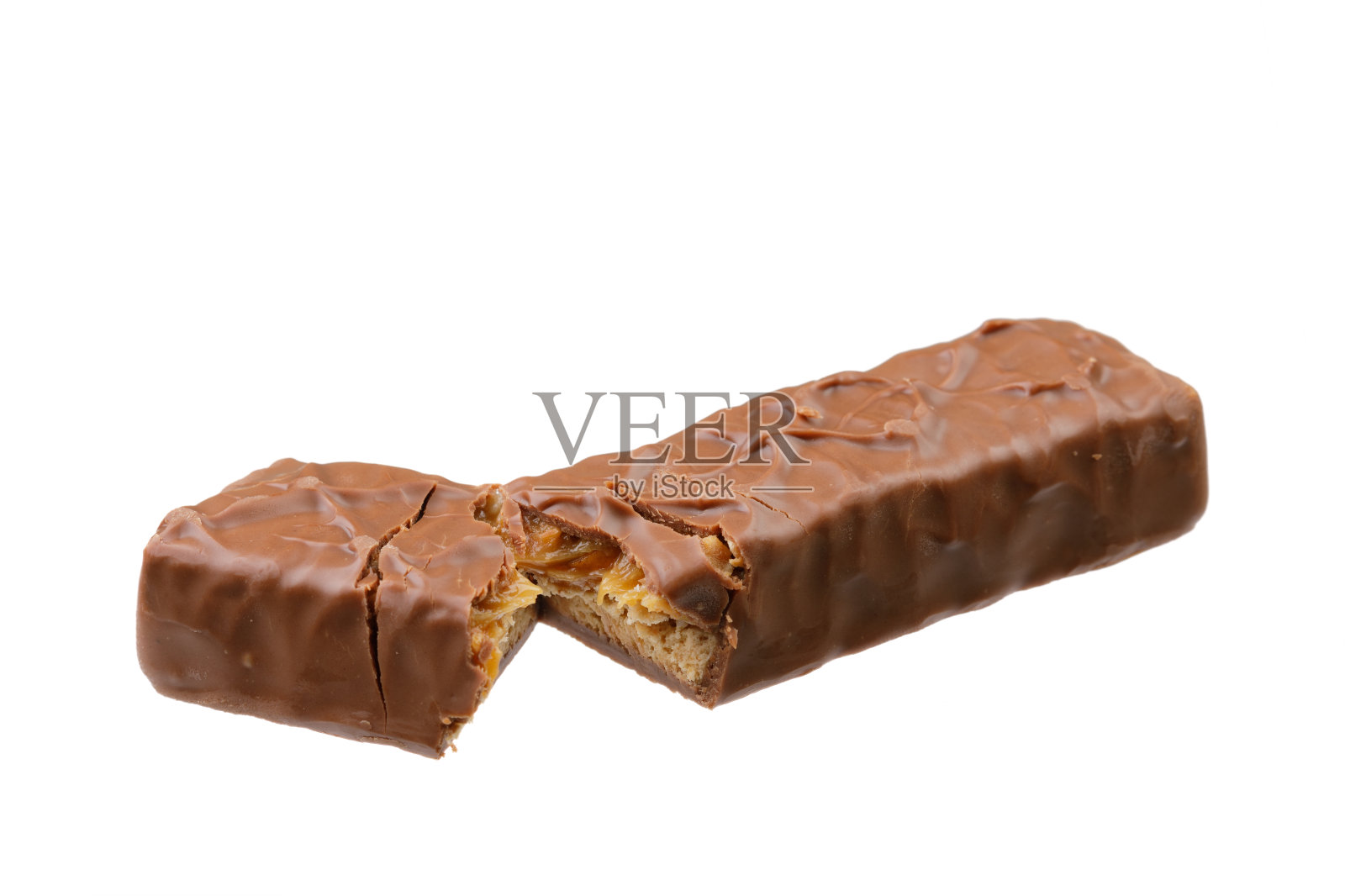 美味的巧克力和焦糖棒隔离在白色的背景照片摄影图片