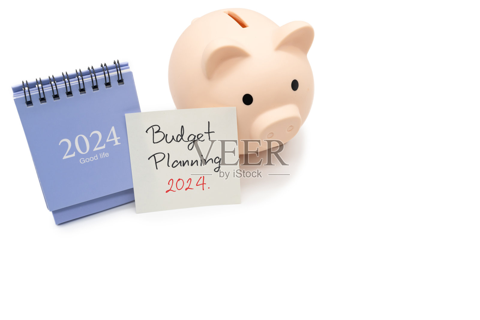 预算规划2024短信手写在纸上的笔记，日历和存钱罐。预算计划概念。照片摄影图片