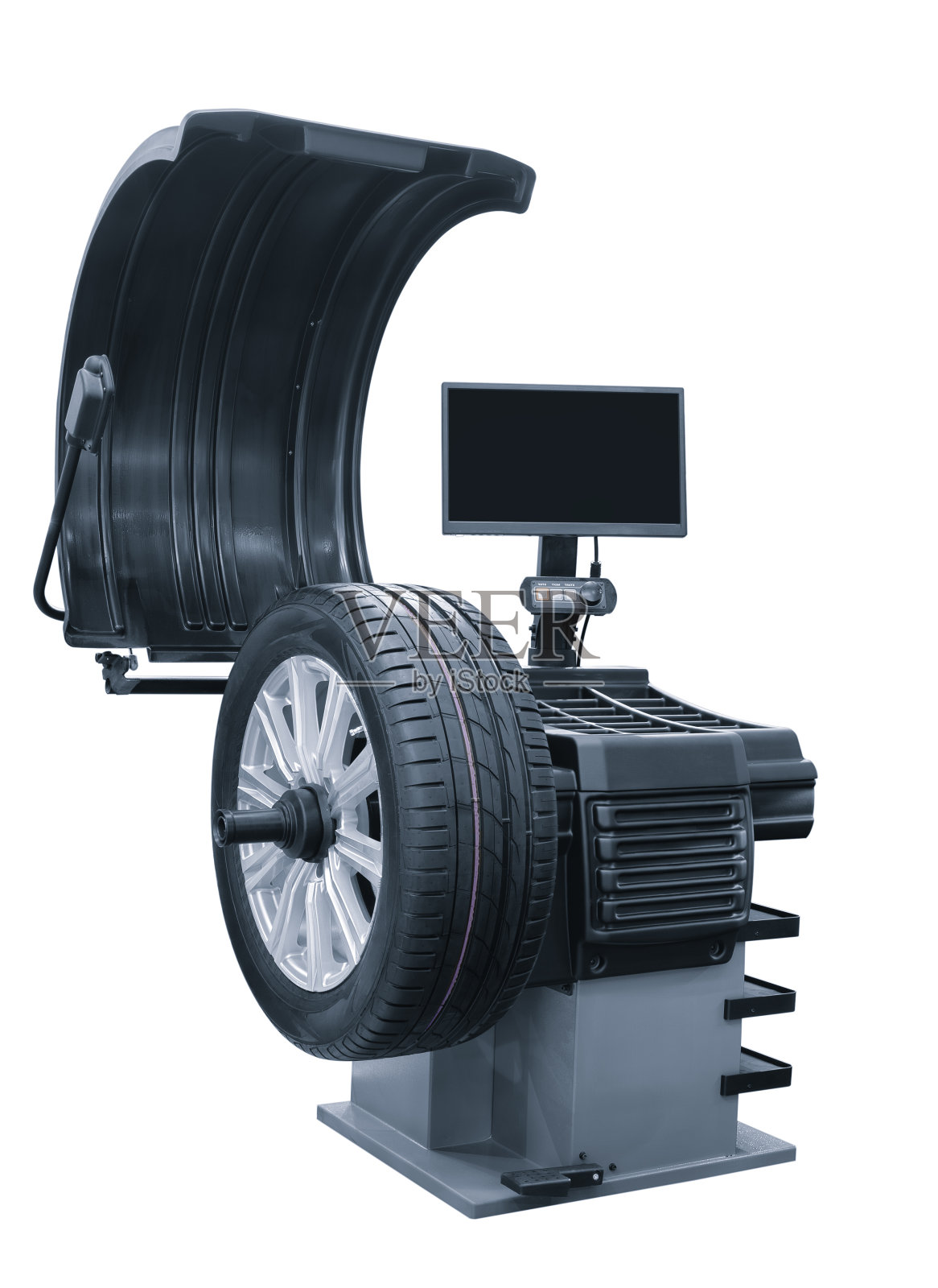 在白色背景上修理和平衡汽车车轮的机器照片摄影图片