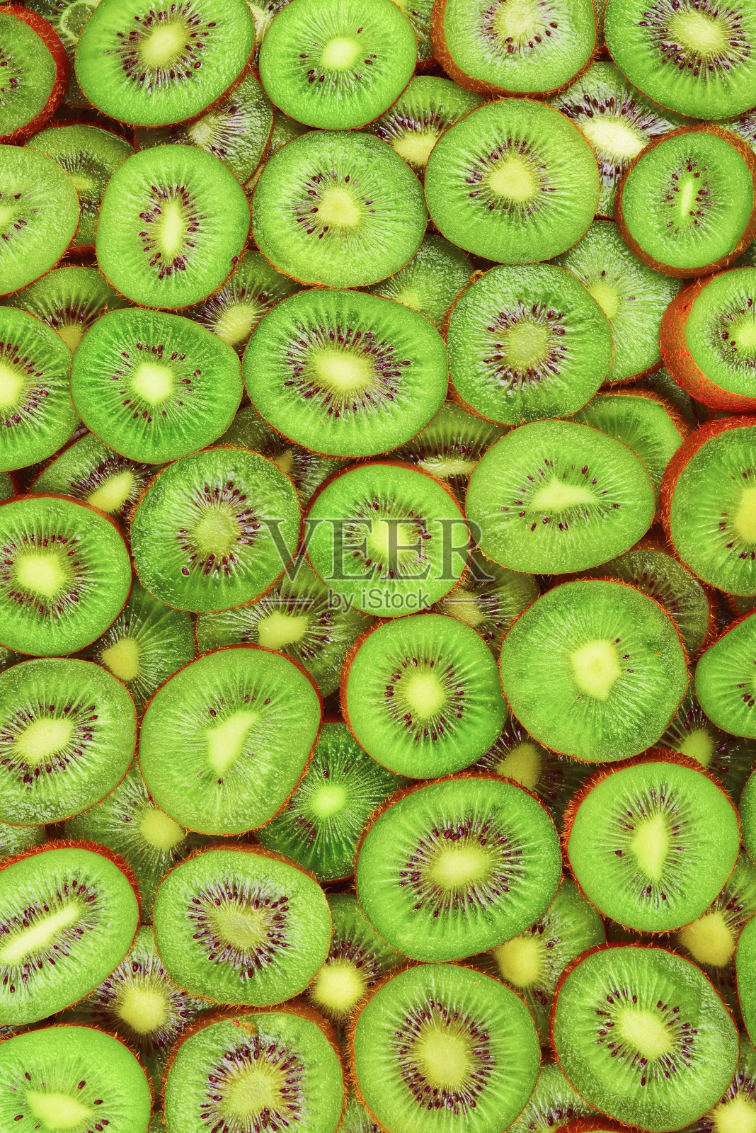 顶部视图堆切片猕猴桃纹理背景。照片摄影图片