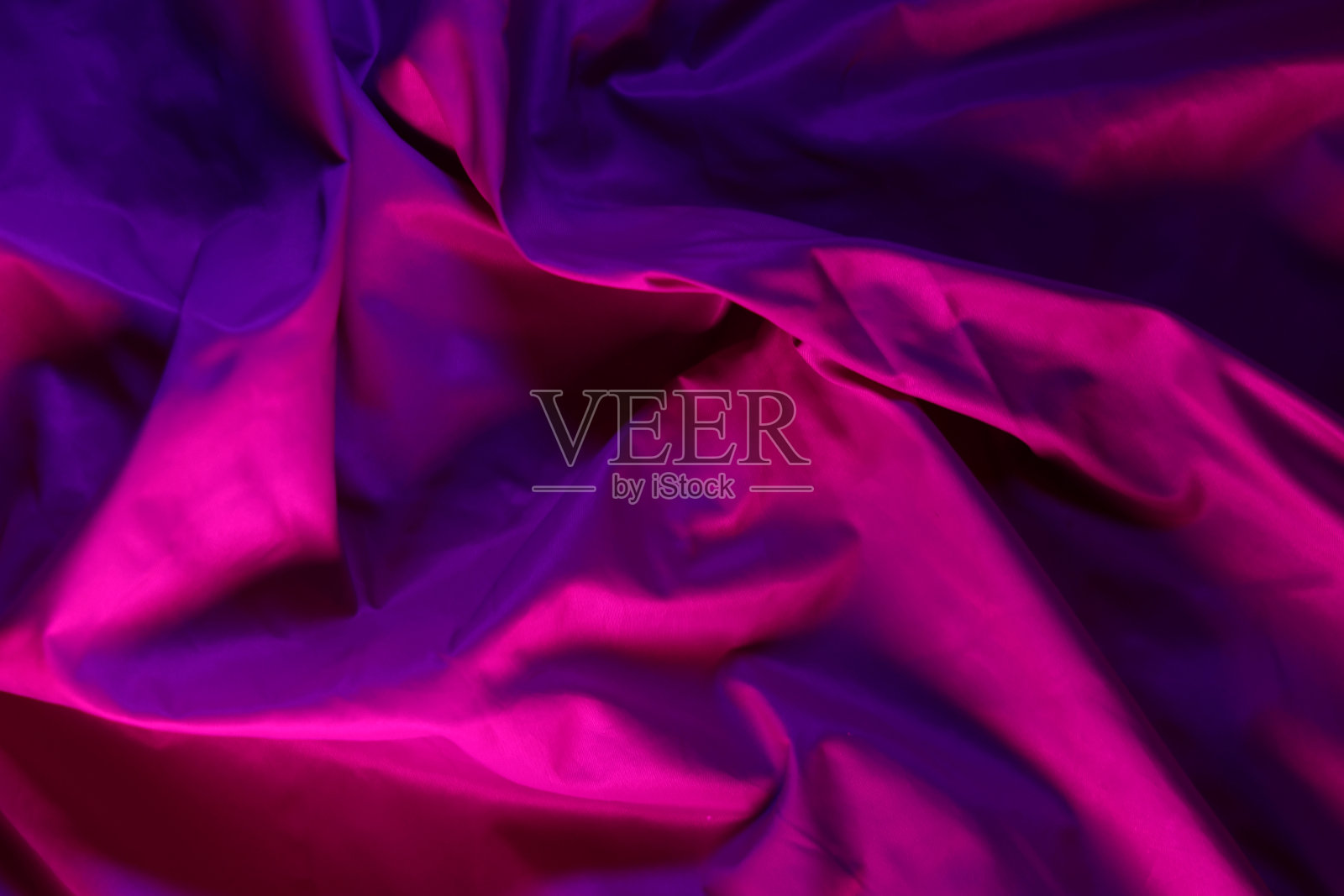 织物背景与霓虹灯照片摄影图片