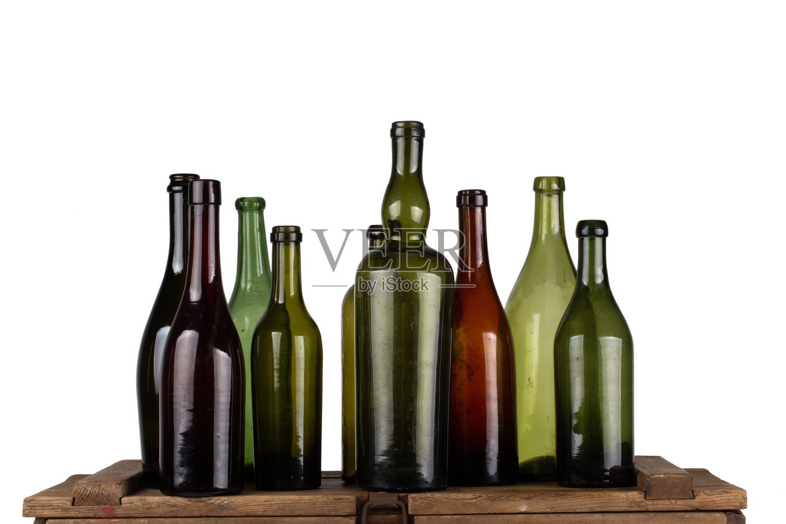 古色古香的绿色玻璃瓶装在木盒上照片摄影图片