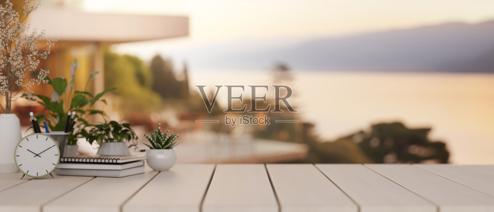 桌面空间以户外别墅空间的模糊背景装饰为特色。照片摄影图片