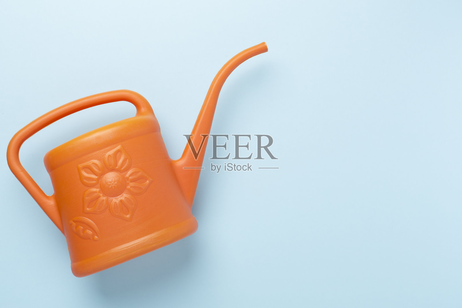 洒水罐的彩色背景，顶部，视图照片摄影图片