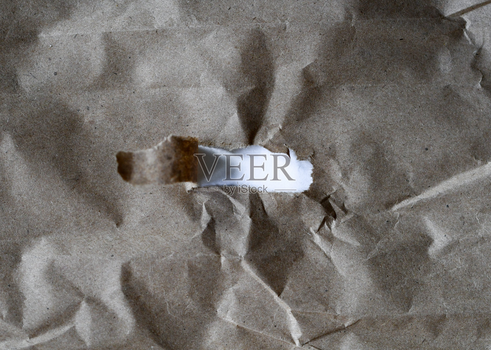 有洞的牛皮纸的纹理和图案照片摄影图片