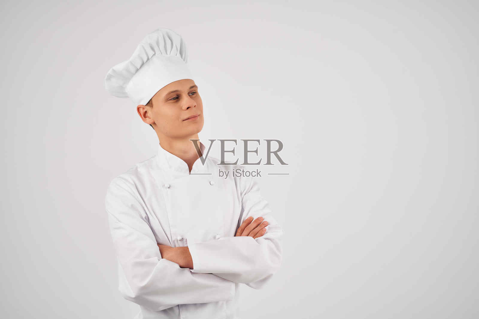 男士穿着厨师制服自信专业的餐厅灯光背景照片摄影图片