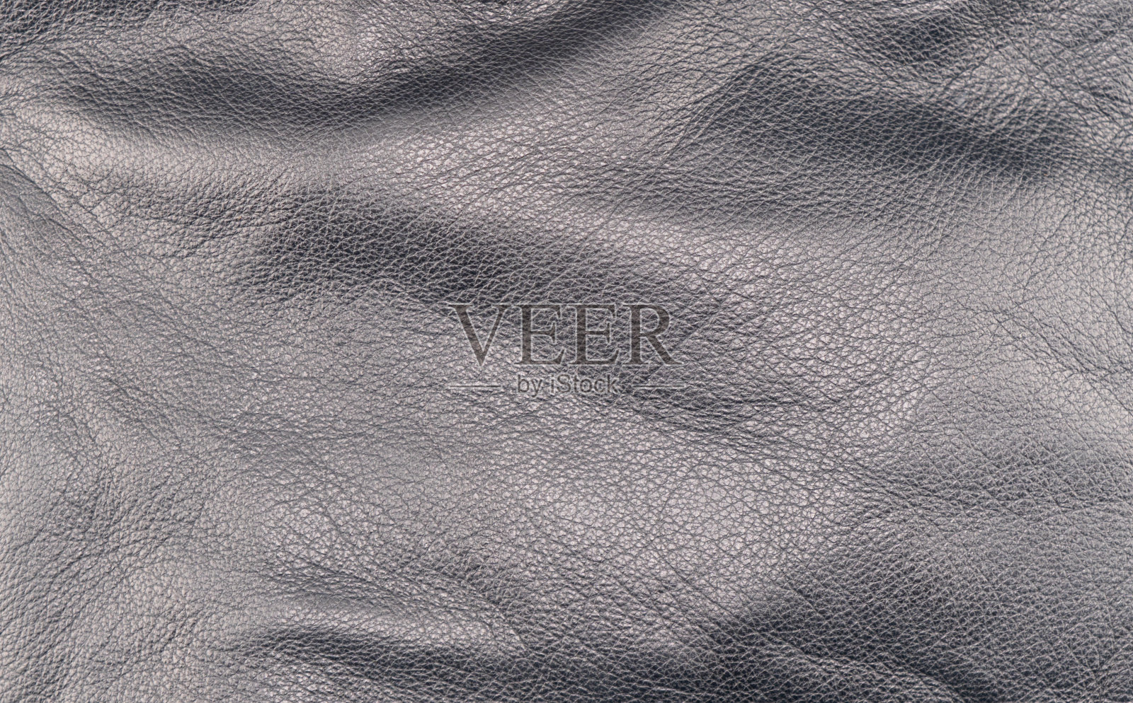 微距拍摄皮革纹理背景。部分穿孔皮革细节。穿孔皮革纹理背景。纹理皮革照片摄影图片