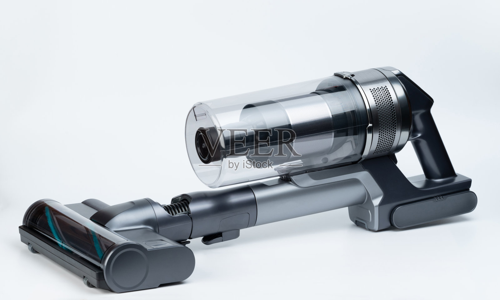 带毛刷的迷你灰色吸尘器照片摄影图片