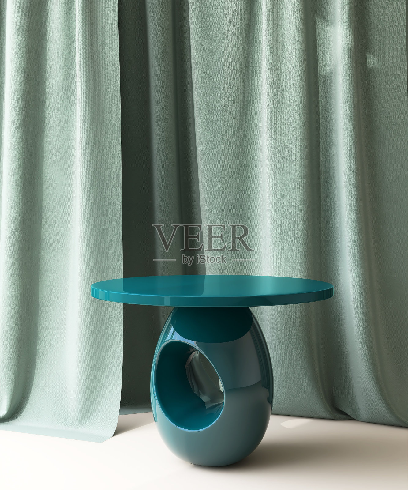 米色地板上的圆形现代绿松石裙台桌子，背景是绿色窗帘照片摄影图片