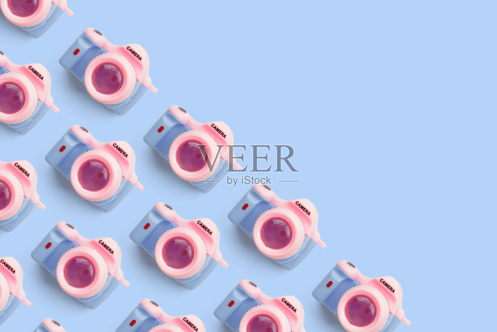 图案与单反相机在柔和的颜色背景照片摄影图片