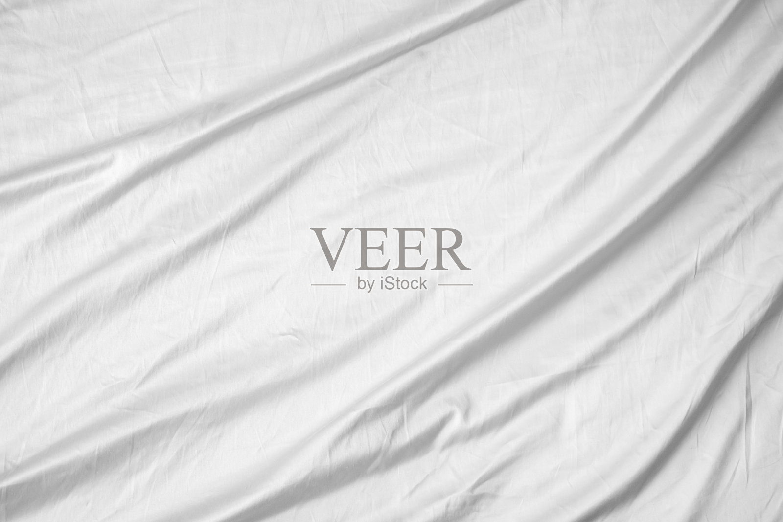 抽象的白色褶皱被单织物纹理背景照片摄影图片