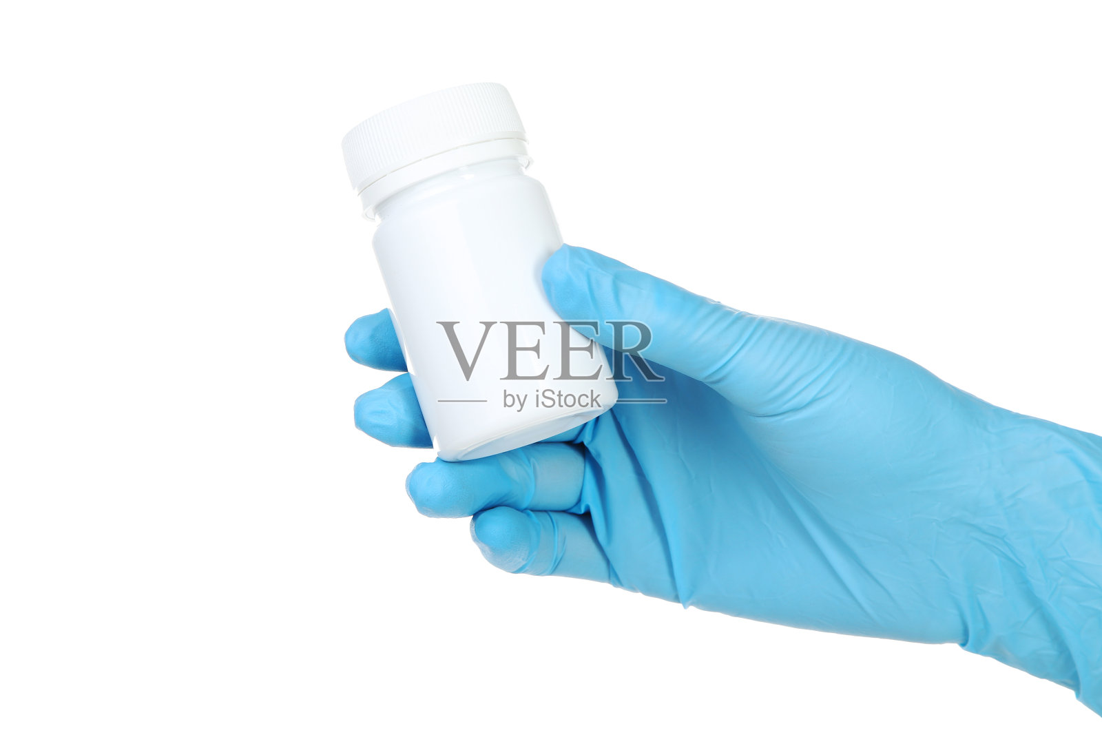 医生手戴手套，拿着白底药瓶照片摄影图片