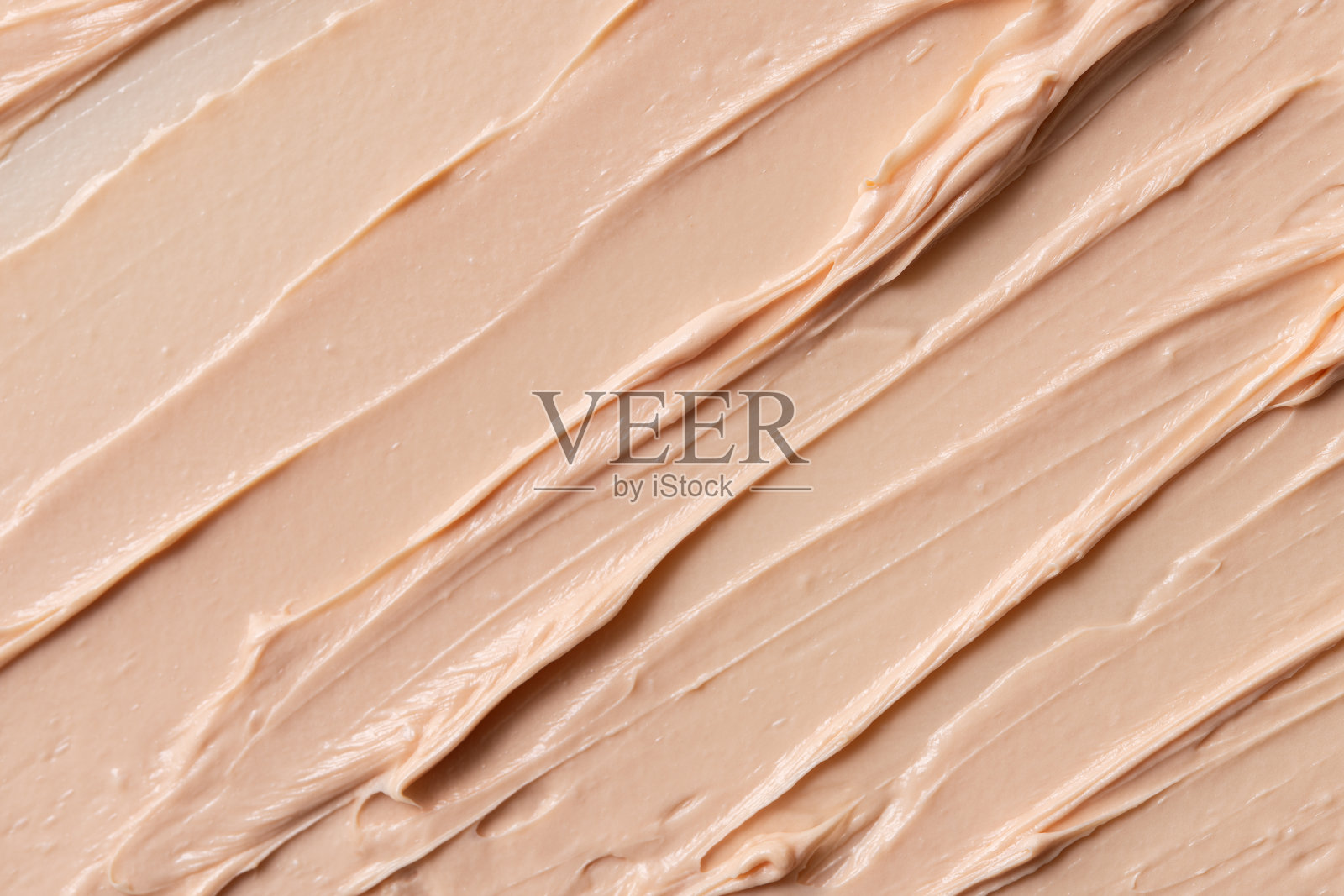 涂抹米色质地的调性面霜照片摄影图片