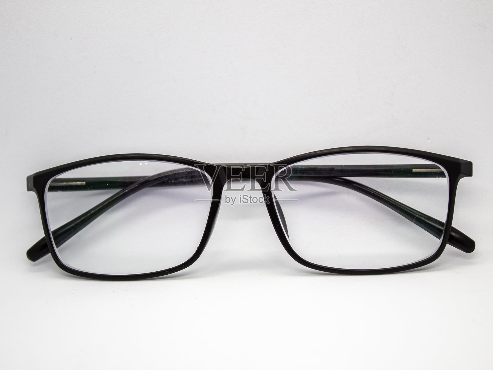 近距离选择性聚焦黑框眼镜照片摄影图片