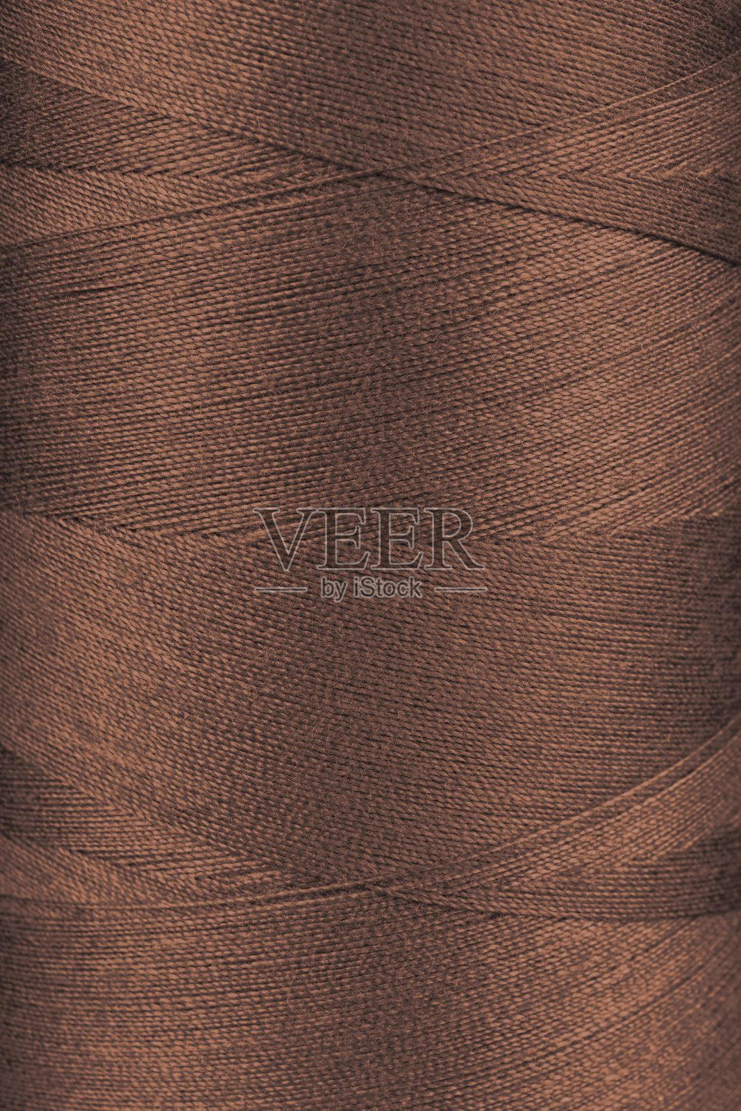 近距离观察线轴上棕色线的纹理照片摄影图片