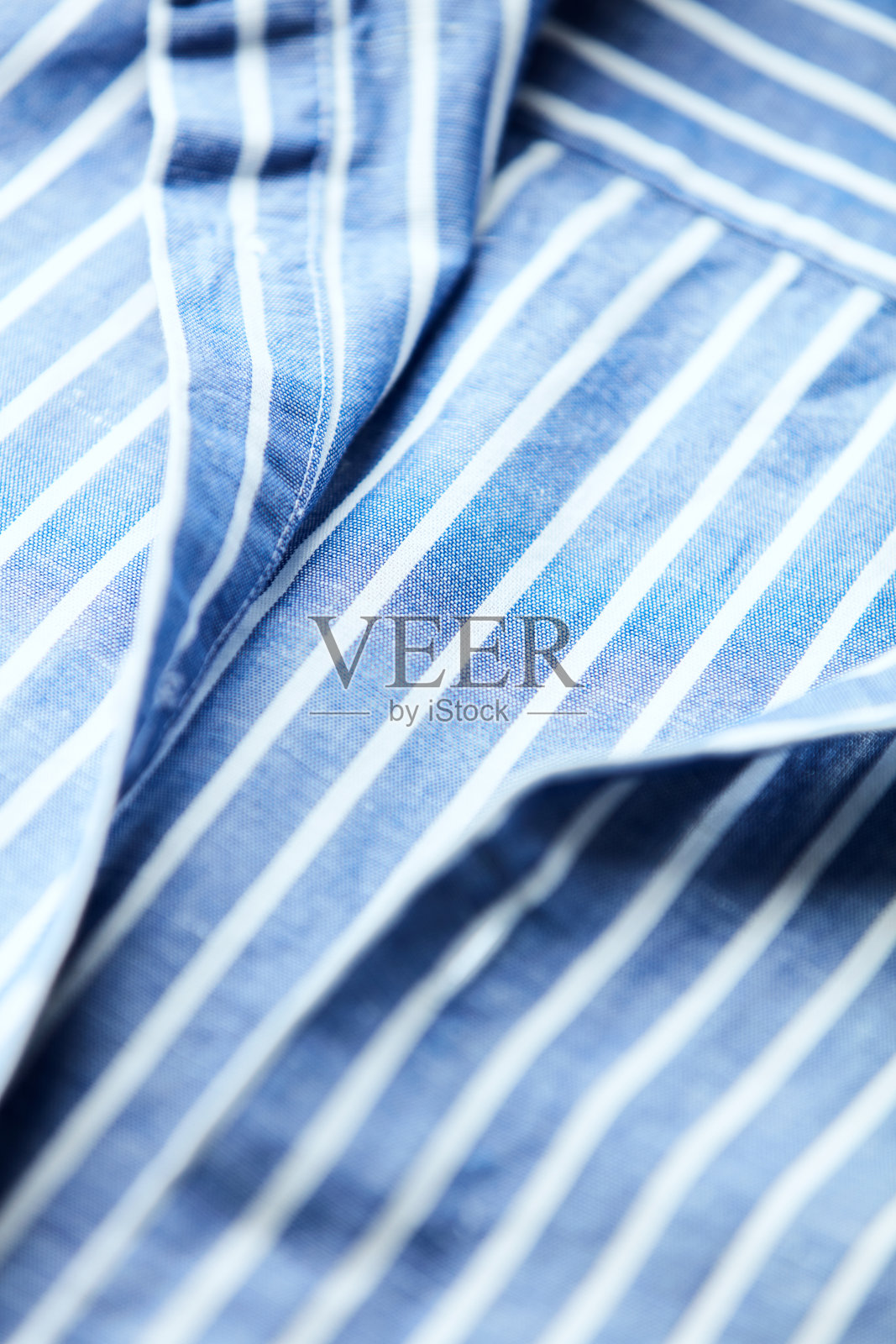 男士亚麻衬衫的特写。照片摄影图片