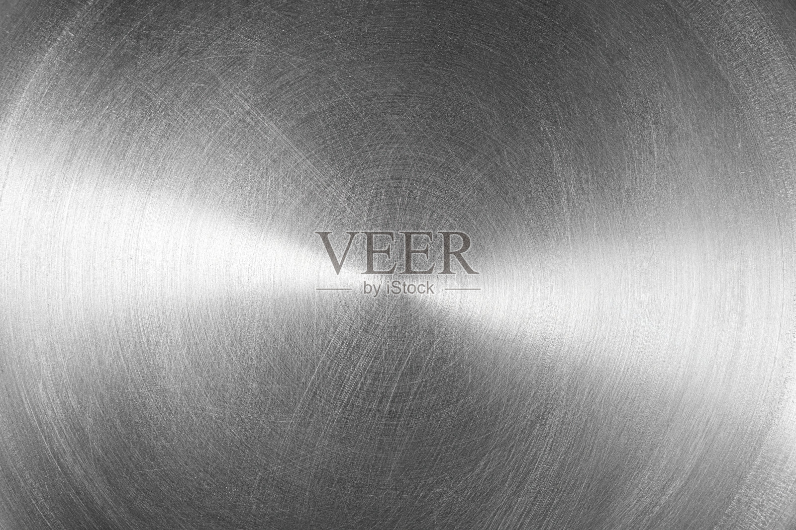 不锈钢或铝圆形拉丝光泽金属纹理。抽象的金属背景。圆的形状。照片摄影图片