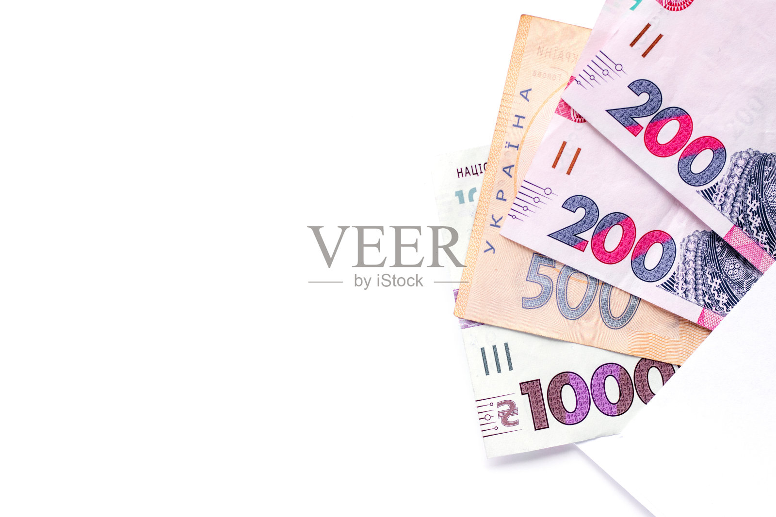 不同面额的乌克兰格里夫纳装在白底信封里。本空间照片摄影图片