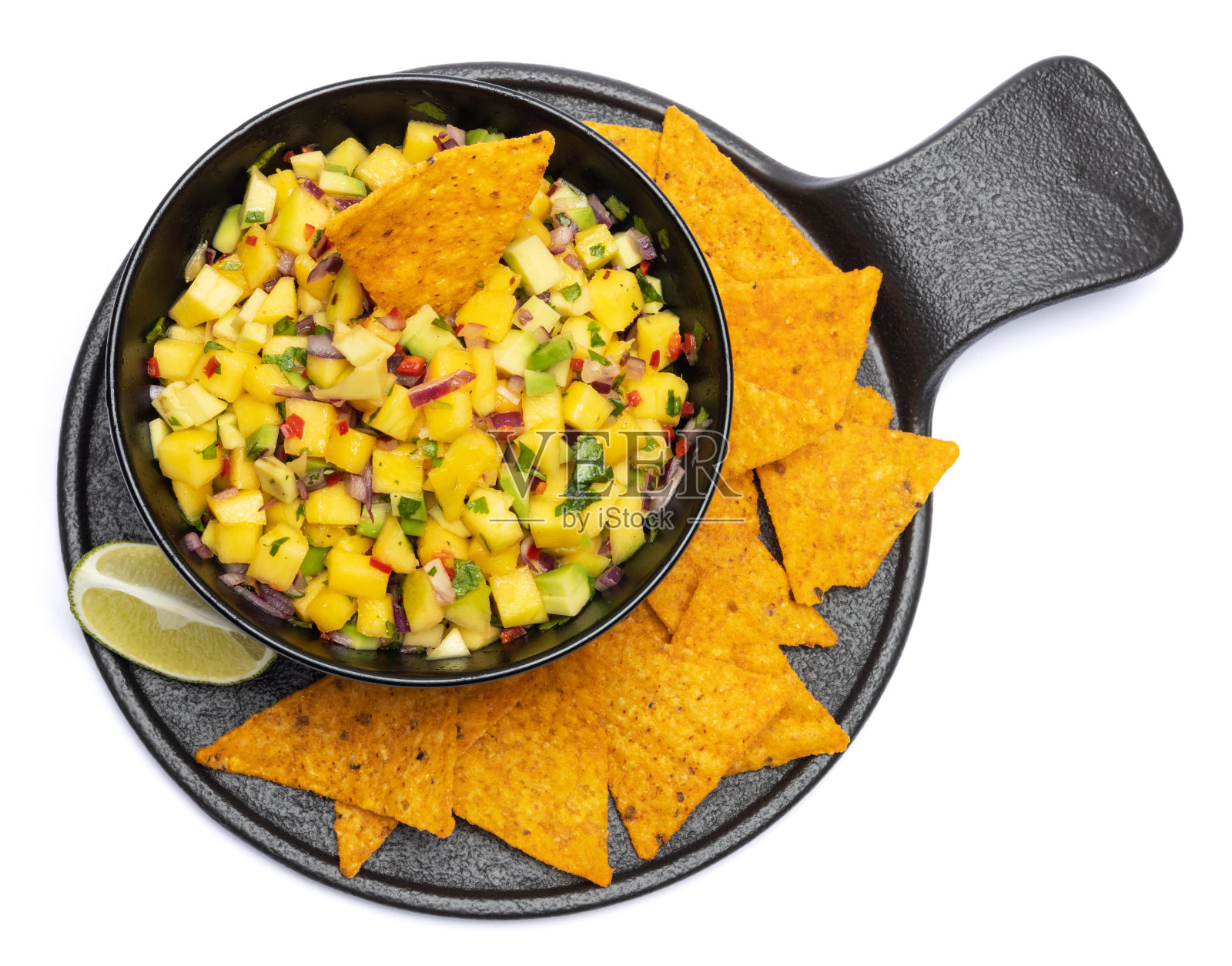 黑色陶瓷碗里新鲜出炉的芒果酱照片摄影图片