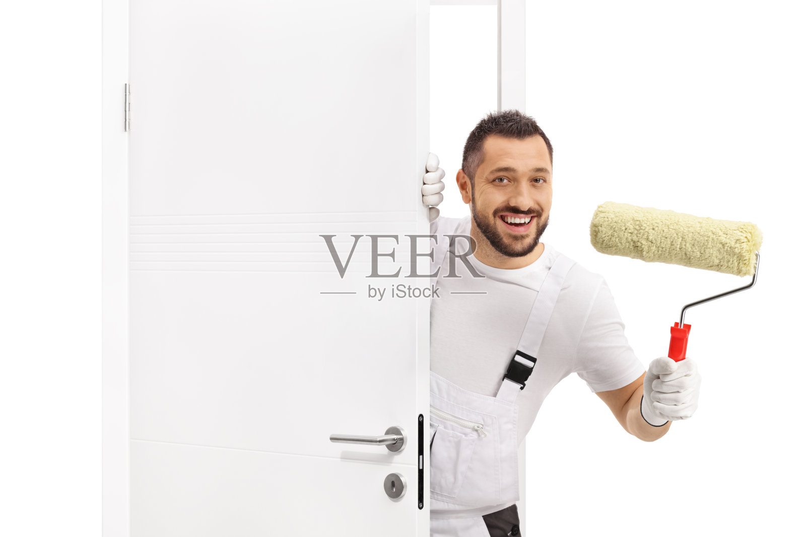 油漆工从门后偷看照片摄影图片