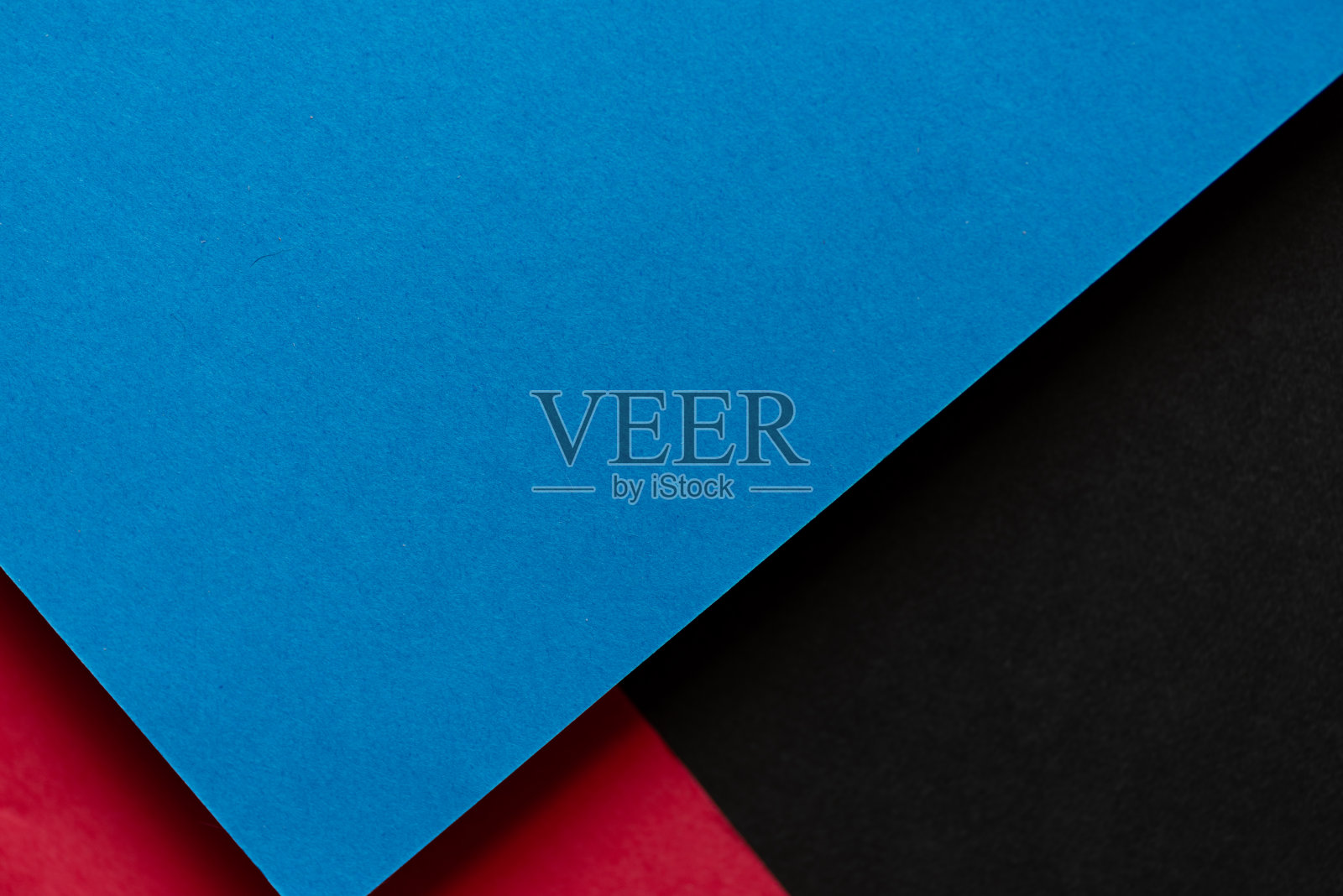 蓝色，红色和黑色重叠的建筑纸背景照片摄影图片