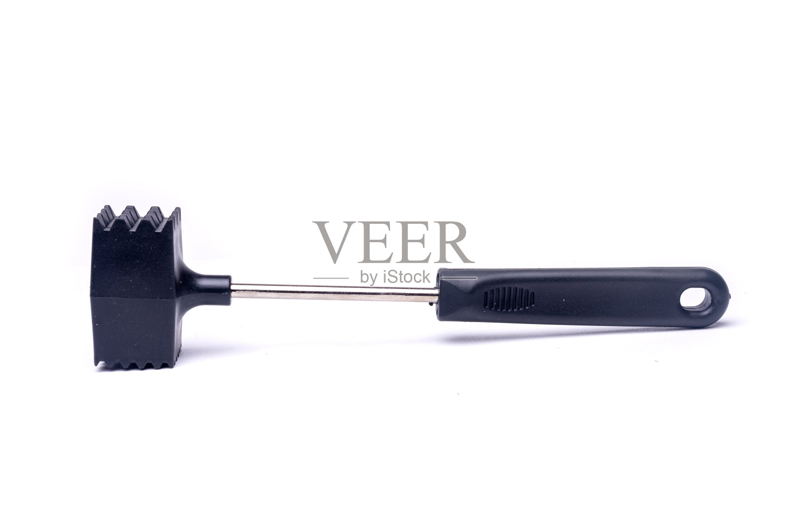 在白肉上敲肉用的锤子照片摄影图片