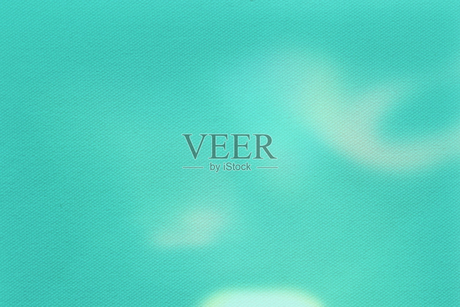 图像以绿色蓝绿色抽象织物纹理为背景。照片摄影图片