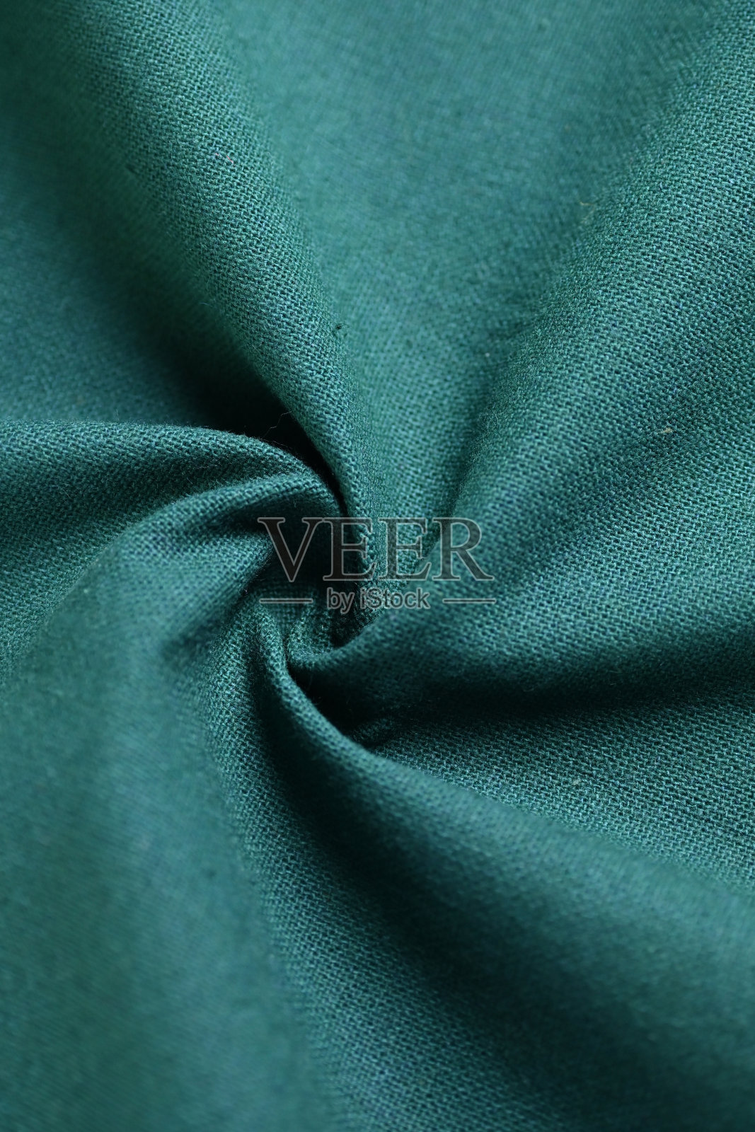 面料的深绿色纹理的纺织品，抽象的形象为时尚布料设计的背景照片摄影图片