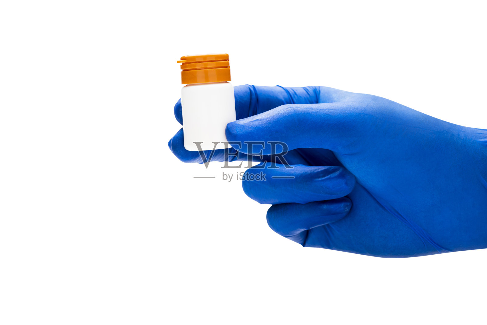 用医用手套拿药瓶的手照片摄影图片