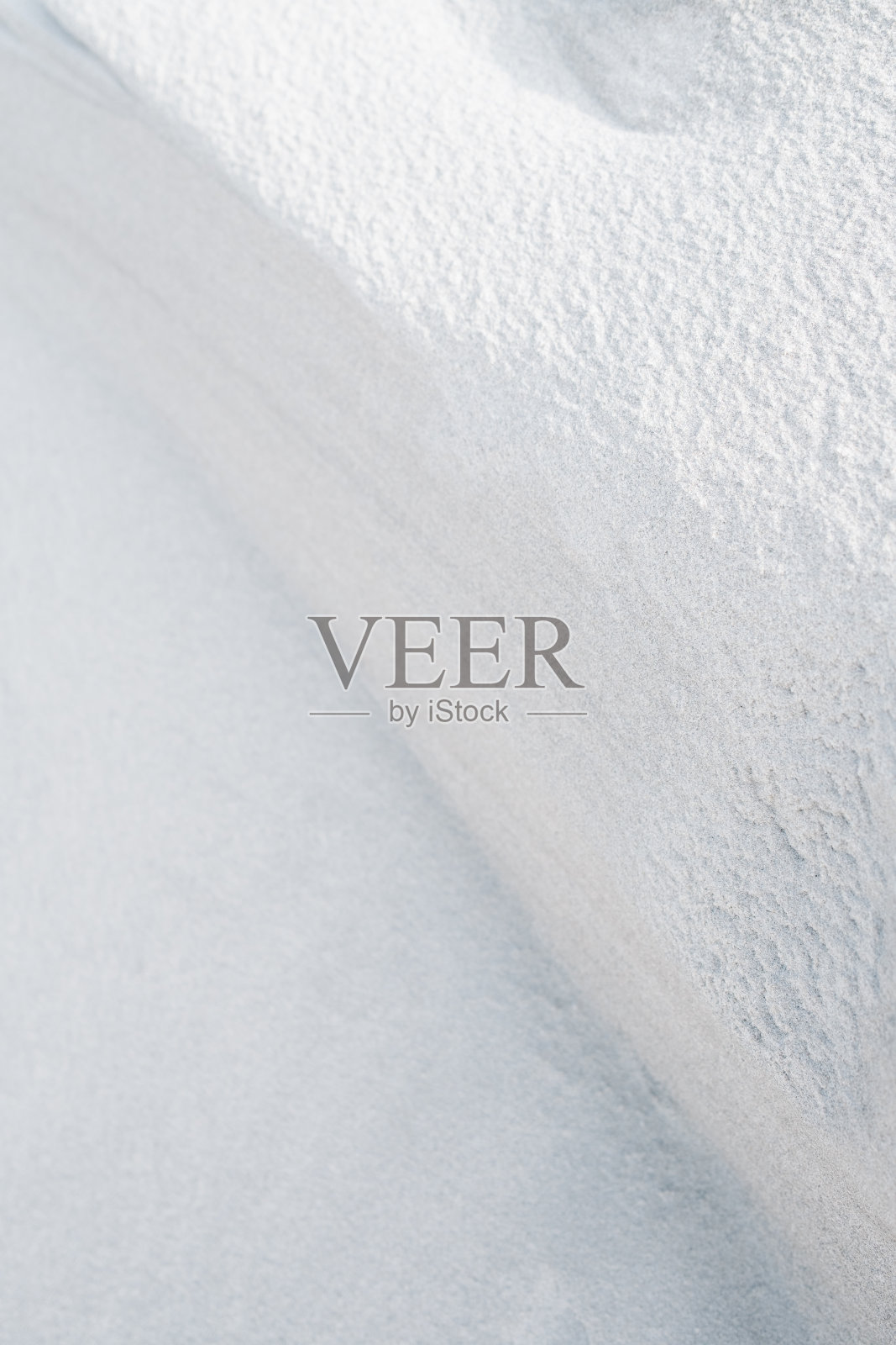 沙丘沙波纹特写纹理在寒冷的冬天早晨的阳光与浅景深照片摄影图片