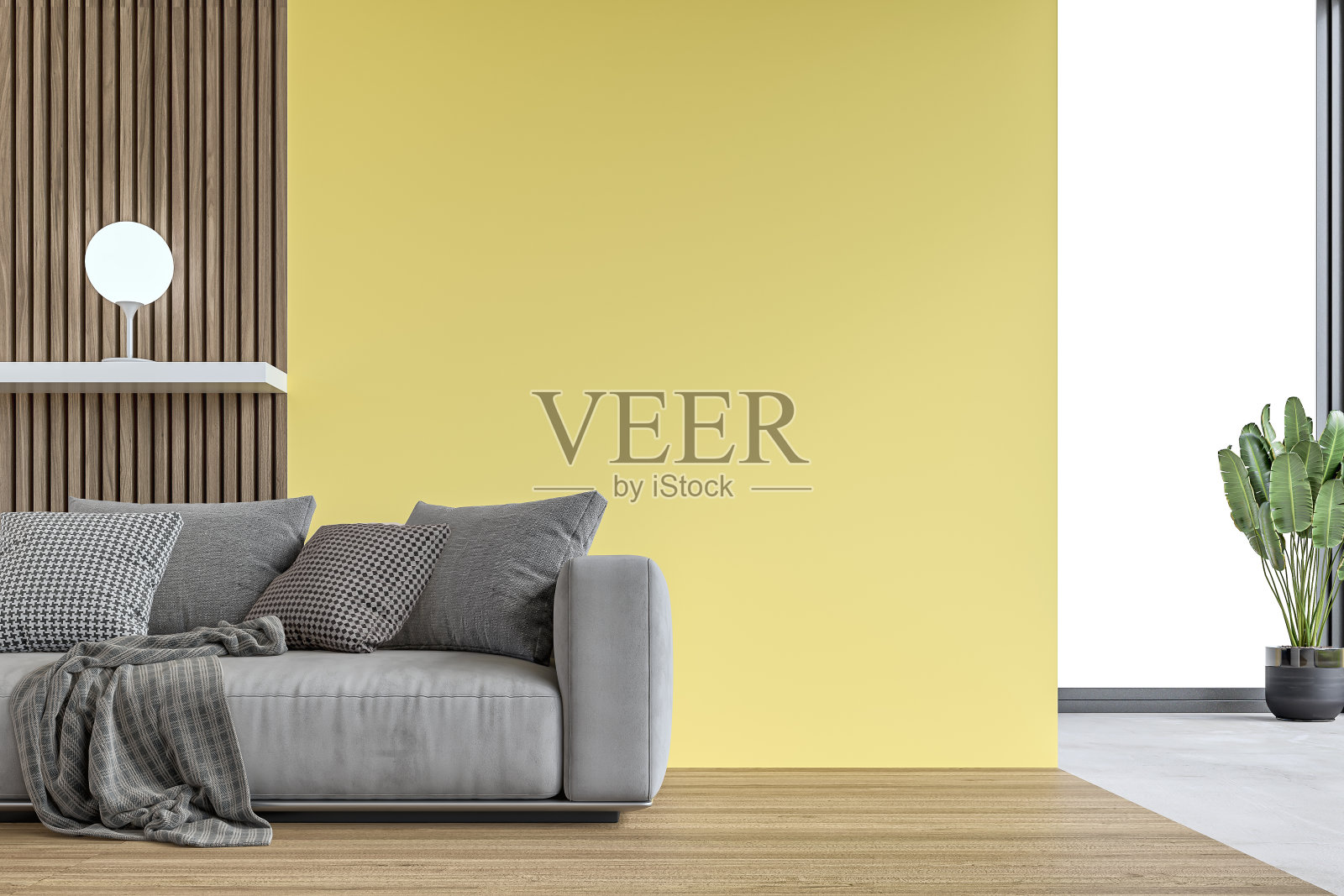 室内装潢现代感十足:客厅里放着灰色沙发，黄灰泥和硬木镶板的墙面背景和装饰，背景里有几扇窗户照片摄影图片