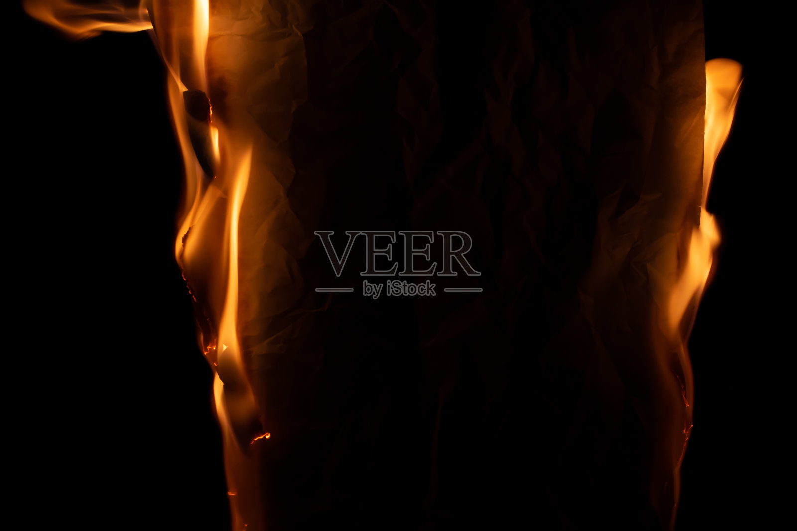 燃烧的纸，发光的纸边照片摄影图片