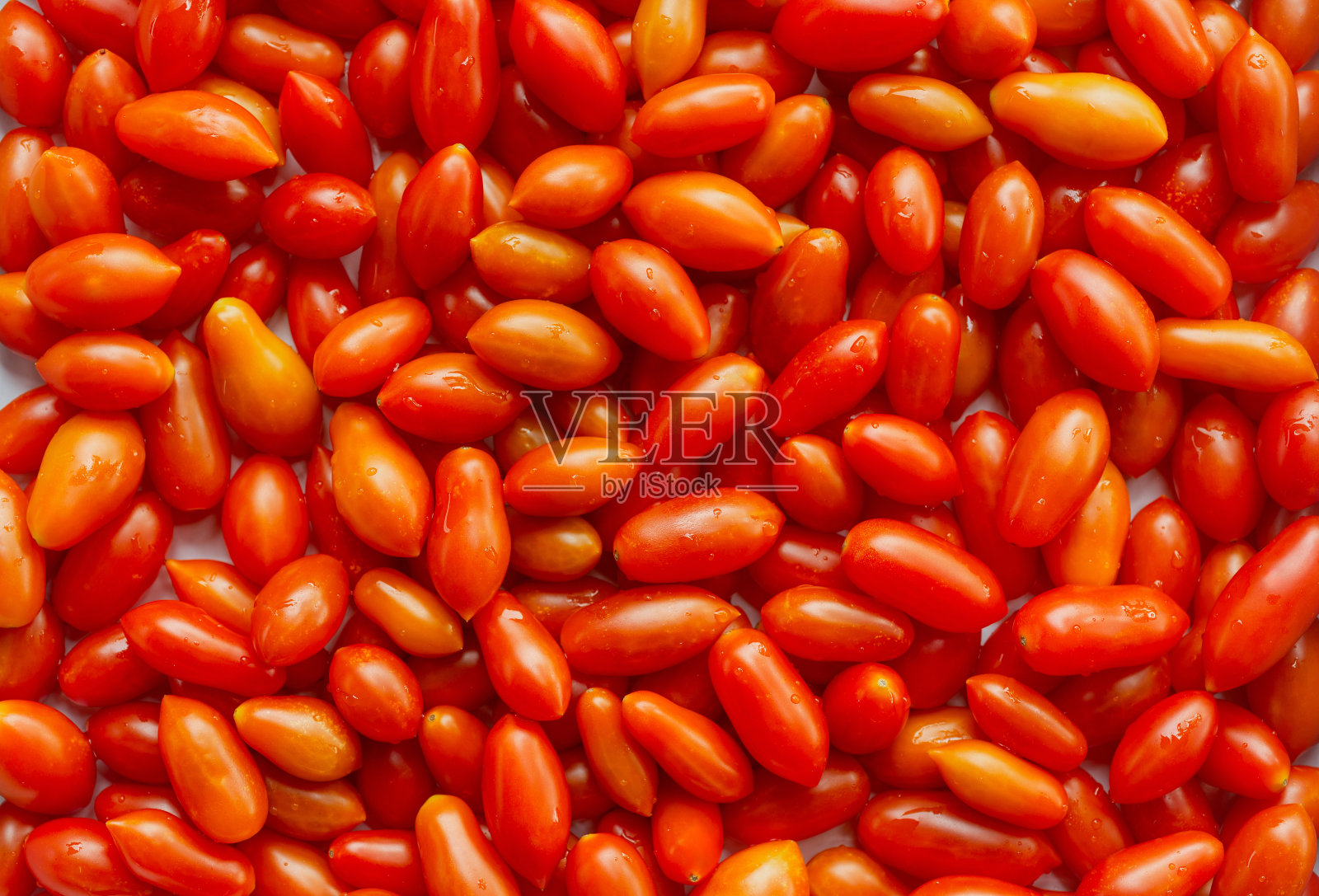 生红色圣女果背景。照片摄影图片