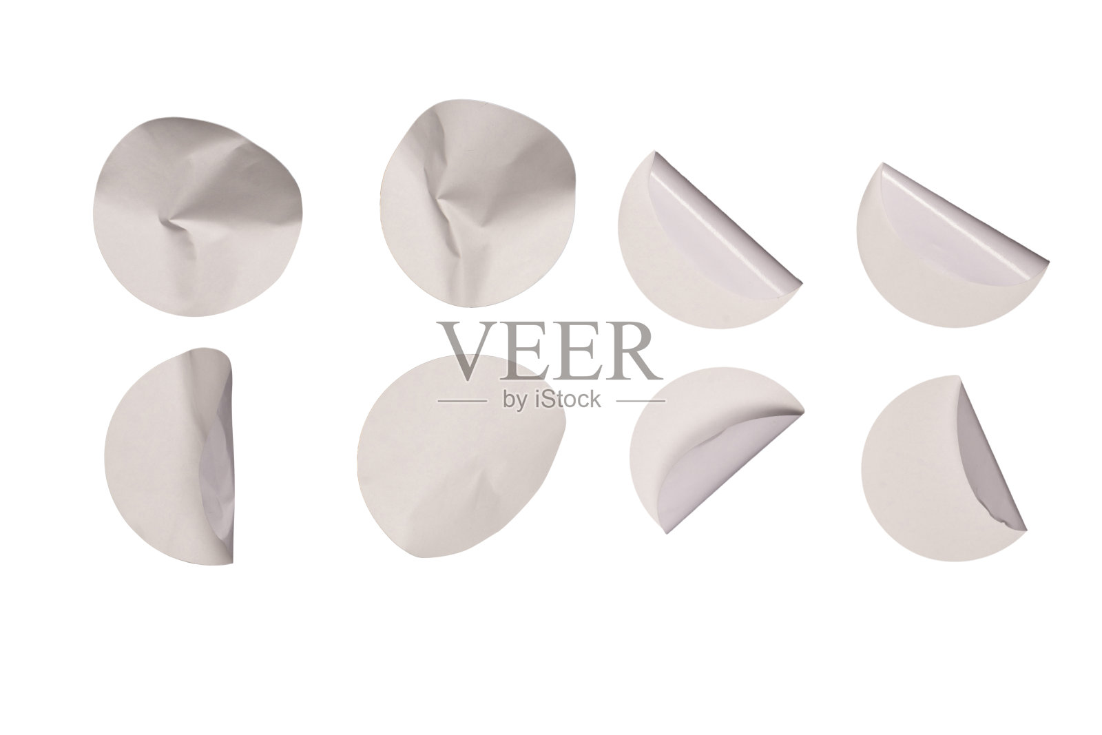 圆形的白色贴纸，空白的标签隔离在白色的背景上。照片摄影图片