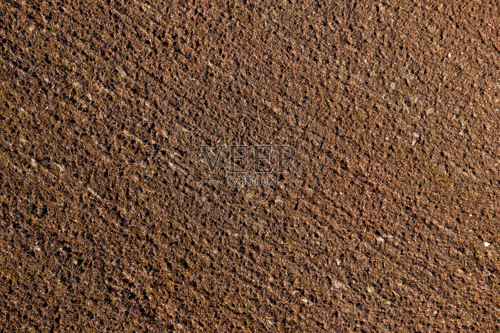 土壤表面纹理特写。抽象的背景和纹理设计。照片摄影图片
