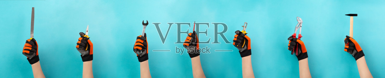 手握不同工具的工匠或杂工，劳动日，手艺和学徒，锤子，钳子和扳手照片摄影图片