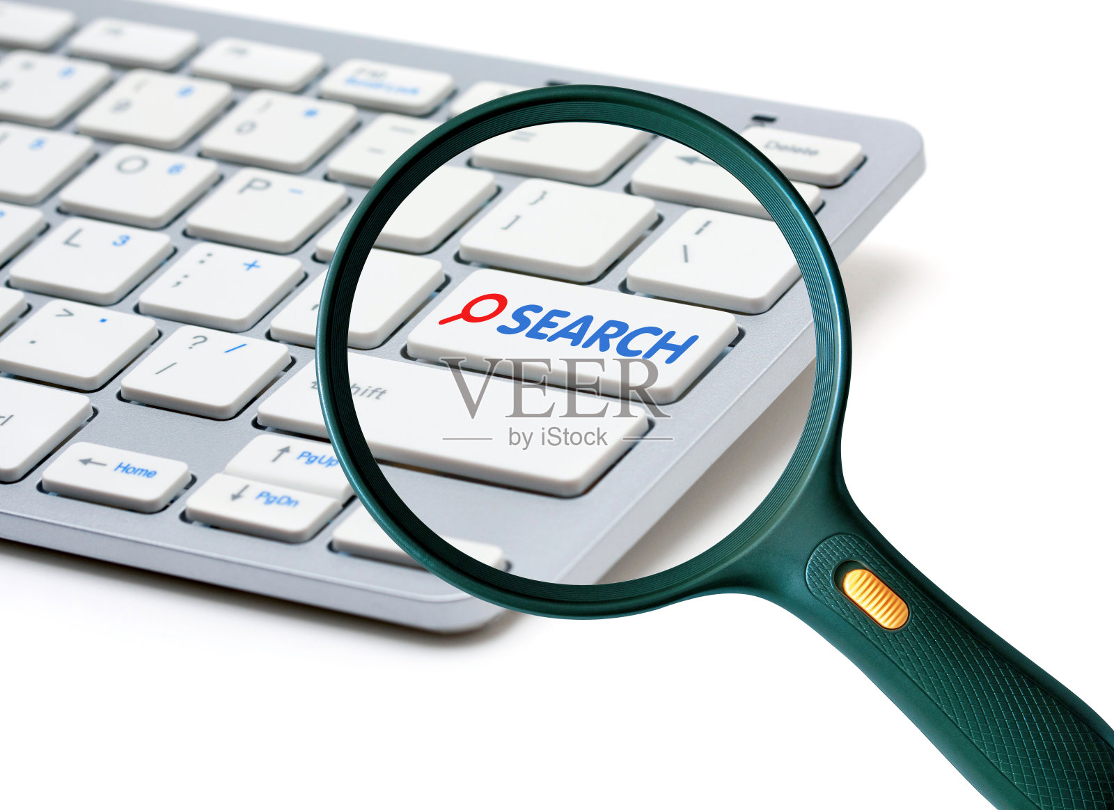 用放大镜在键盘上写着"搜索照片摄影图片