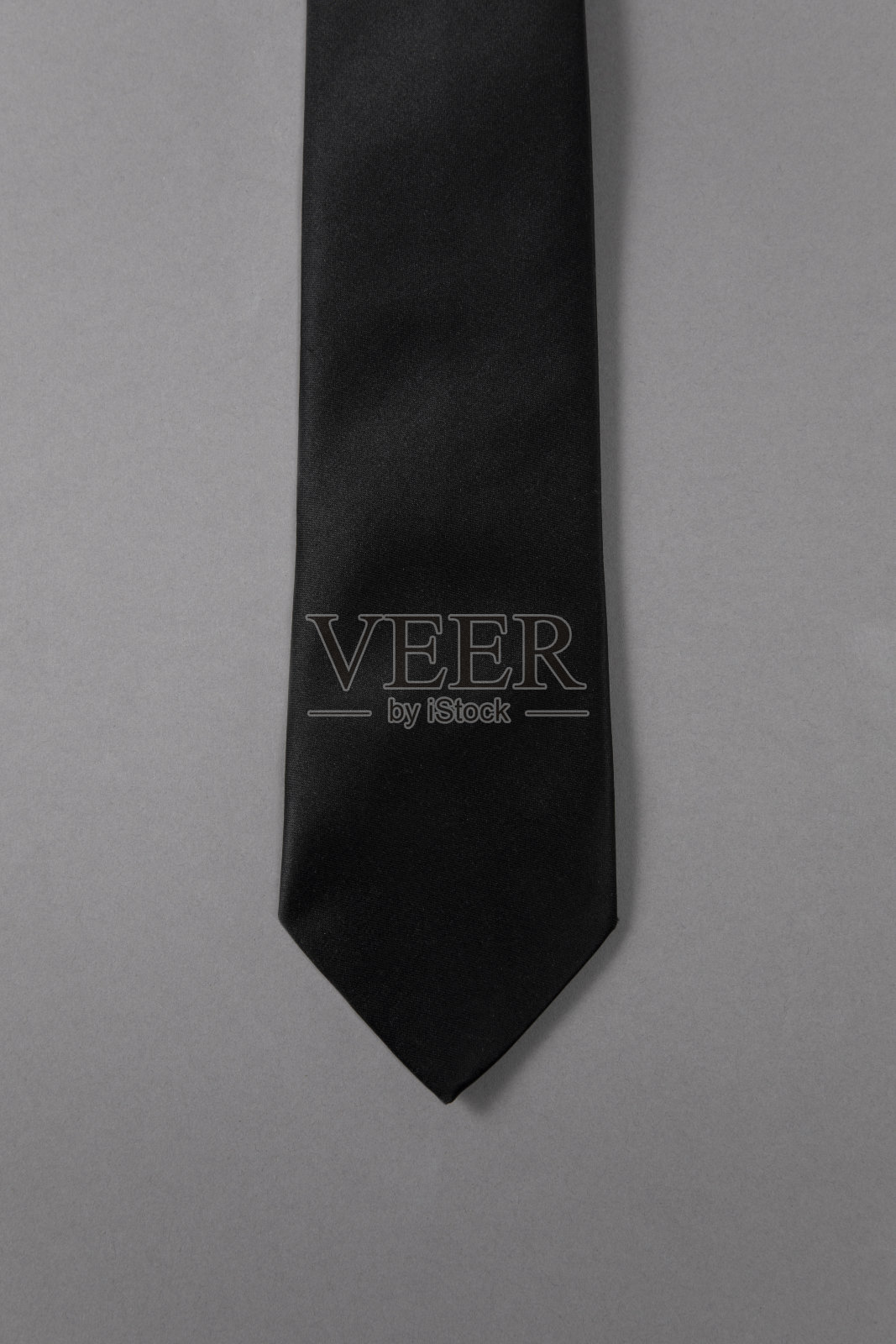 灰色背景上的领带照片摄影图片