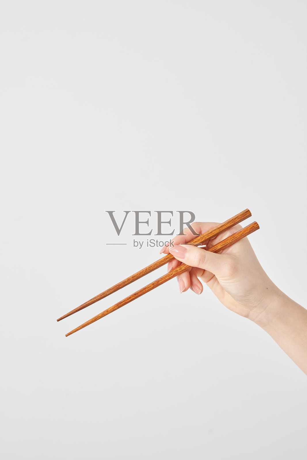 一个女人拿筷子的手照片摄影图片