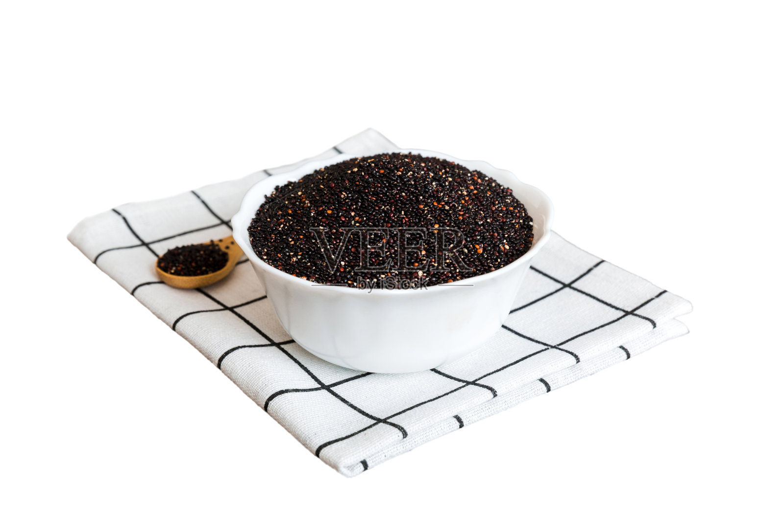 奎奴亚藜籽在碗和勺子在彩色背景。小碗里的健康金蛙。健康的超级食物照片摄影图片