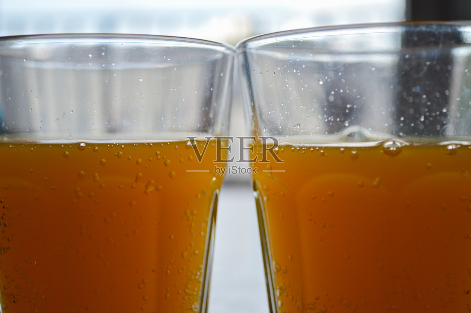 两杯橙汁饮料照片摄影图片