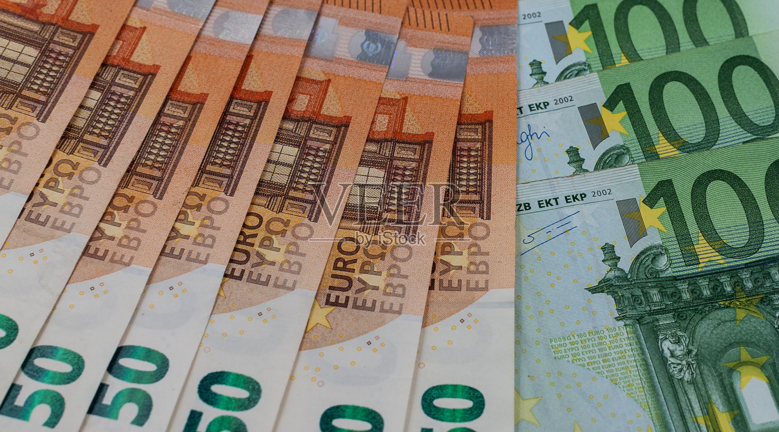 欧元货币纸币背景。欧洲纸币背景，100欧元和50欧元纸币。照片摄影图片