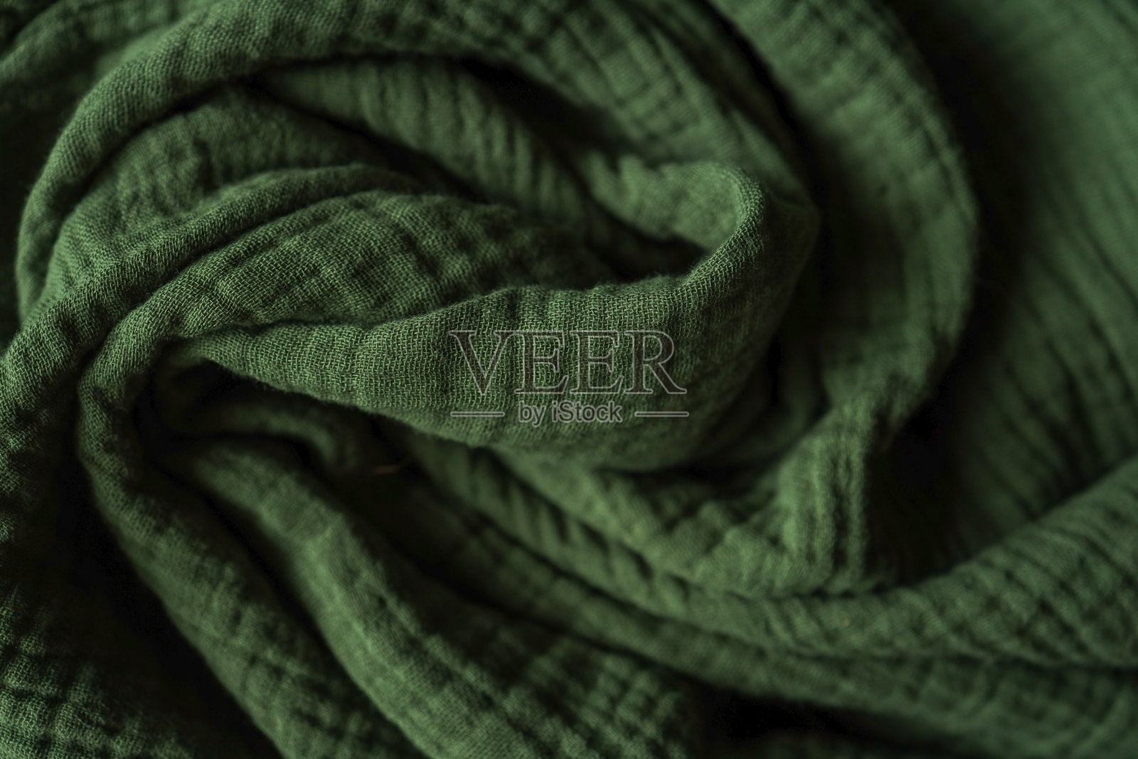 一张特写照片显示了一块绿色的织物照片摄影图片