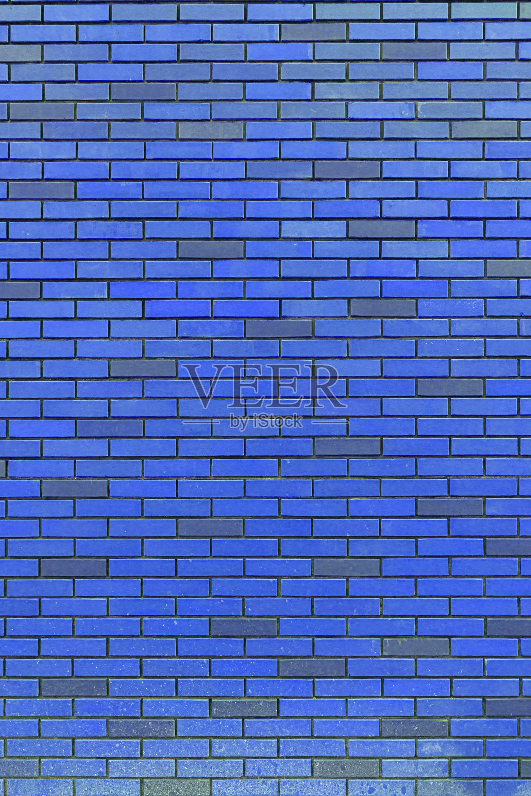 蓝砖墙。照片摄影图片