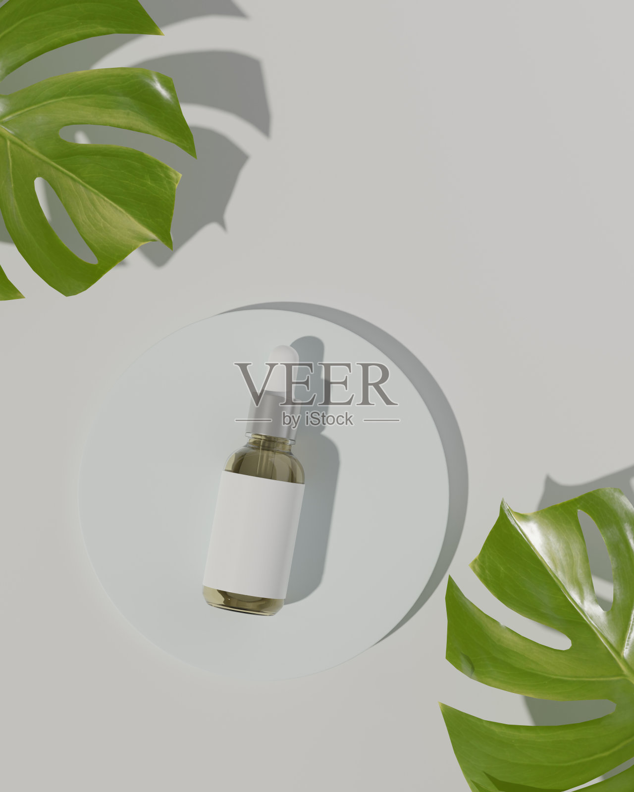 白色背景上的圆筒上的滴管玻璃瓶的俯视图。照片摄影图片