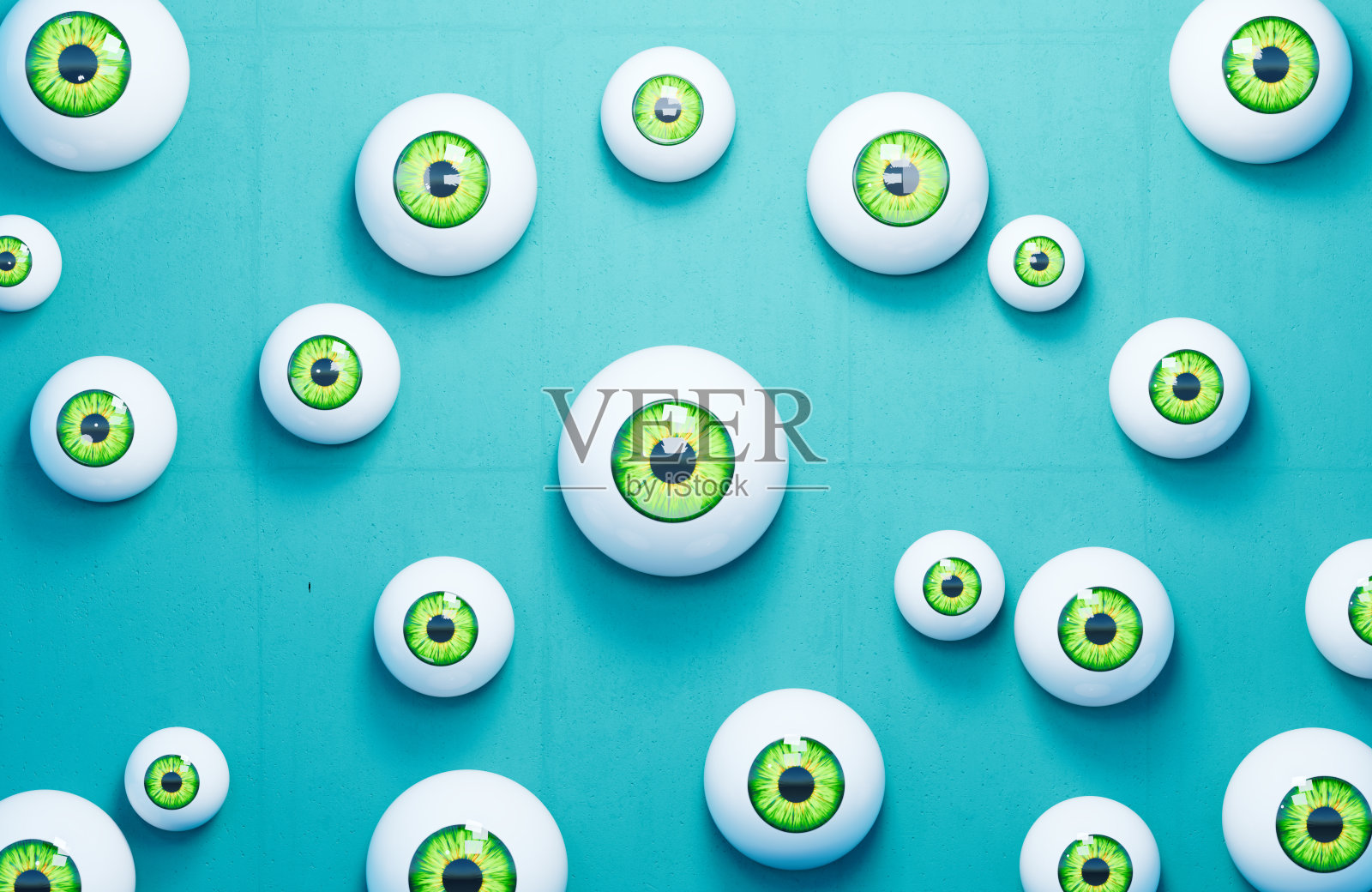 眼球分散在蓝色背景上照片摄影图片