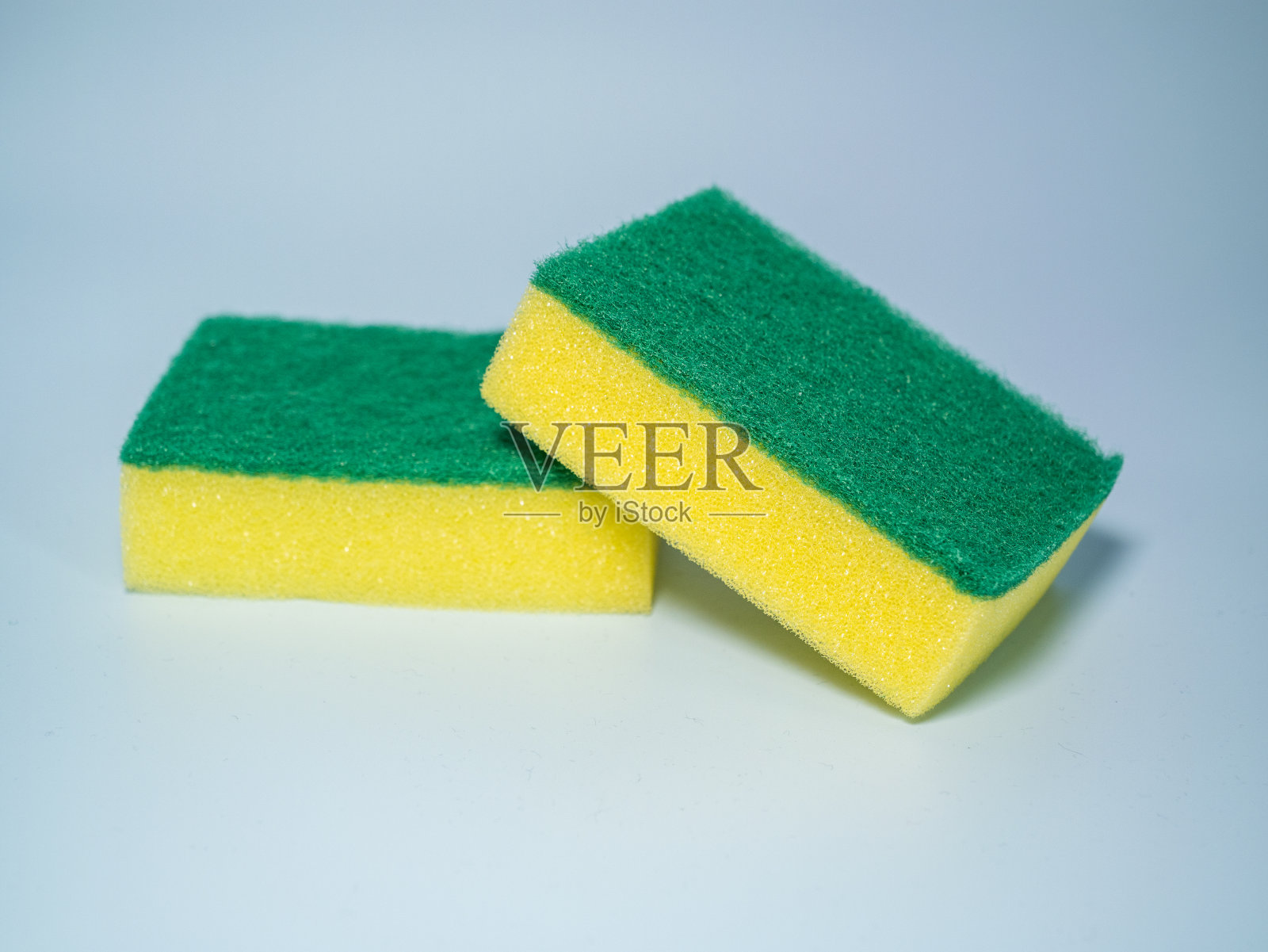 黄色洗碗海绵特写。照片摄影图片